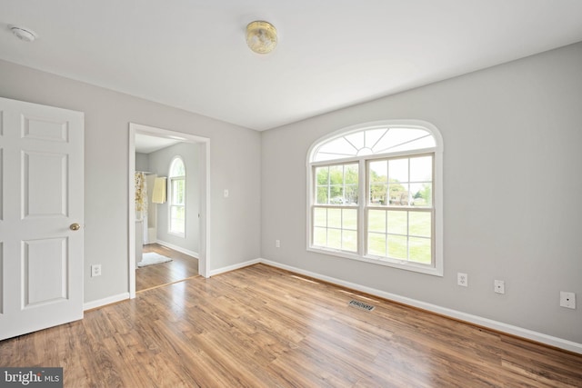 11490 Tilia Ln, Bealeton, VA 22712 - unfurnished room with baseboards, healthy amount of natural light, wood finished floors, and a smoke detector