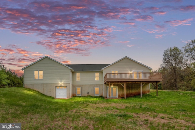 11490 Tilia Ln, Bealeton, VA 22712 - back of property featuring a deck, a lawn, and a garage