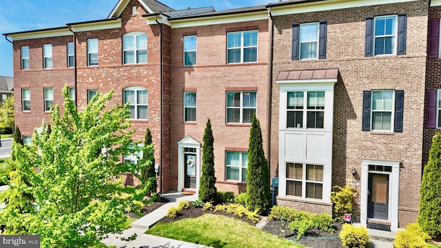 multi unit property featuring brick siding