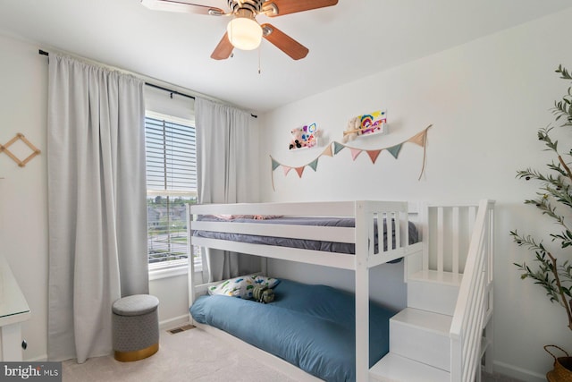 bedroom featuring baseboards, carpet, and ceiling fan