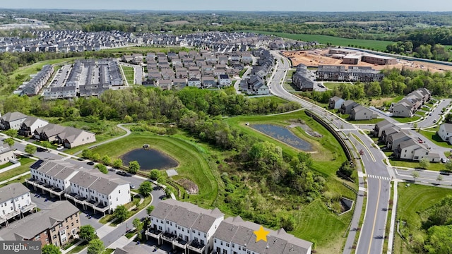 view of property location with nearby suburban area and a large body of water