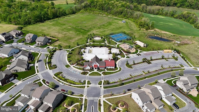 aerial view of property's location featuring nearby suburban area and a local golf course