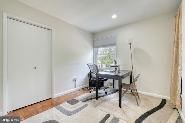 home office featuring recessed lighting, baseboards, and wood finished floors