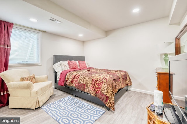 bedroom with wood finished floors, recessed lighting, and baseboards