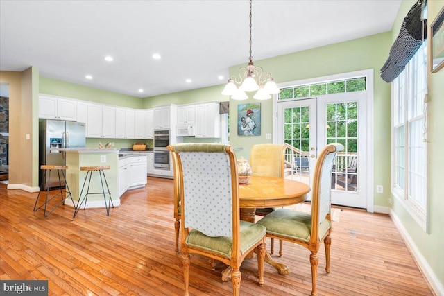 3747 Spicebush Dr, Frederick, MD 21704 - dining area with a chandelier, baseboards, light wood-type flooring, and recessed lighting