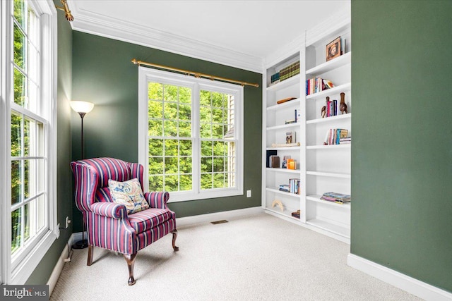 3747 Spicebush Dr, Frederick, MD 21704 - living area with baseboards, carpet flooring, built in features, healthy amount of natural light, and crown molding