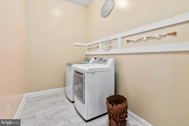 3747 Spicebush Dr, Frederick, MD 21704 - laundry room with light marble finish floors, independent washer and dryer, and baseboards
