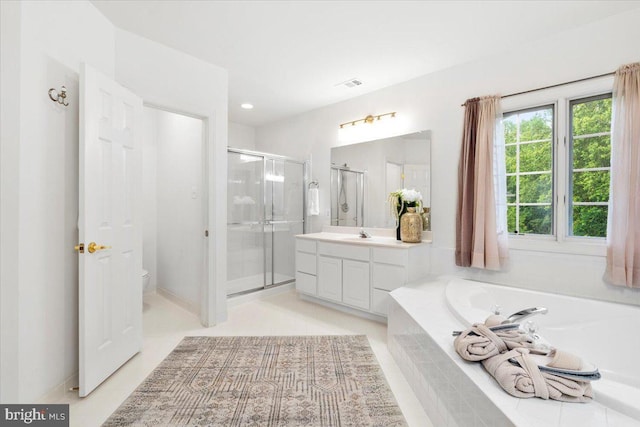 3747 Spicebush Dr, Frederick, MD 21704 - bathroom featuring a shower stall, vanity, a garden tub, toilet, and recessed lighting