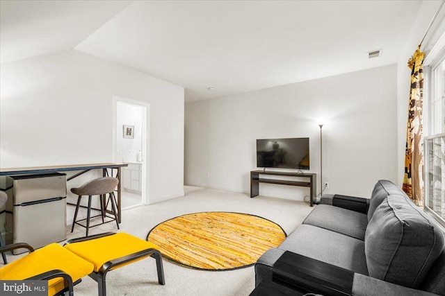 3747 Spicebush Dr, Frederick, MD 21704 - living area with light colored carpet, lofted ceiling, and baseboards