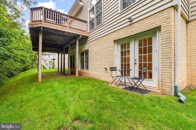 3747 Spicebush Dr, Frederick, MD 21704 - view of grassy yard featuring a deck and french doors