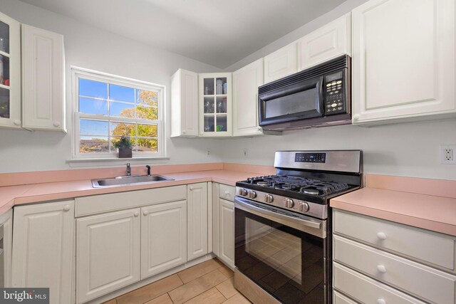 316 Nautilus Dr, Manahawkin, NJ 08050 - kitchen featuring black microwave, gas range, a sink, and light countertops