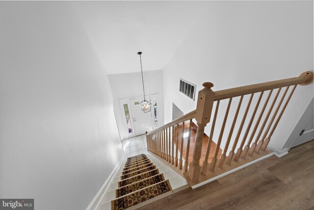 316 Nautilus Dr, Manahawkin, NJ 08050 - stairs with high vaulted ceiling, wood finished floors, baseboards, and a chandelier
