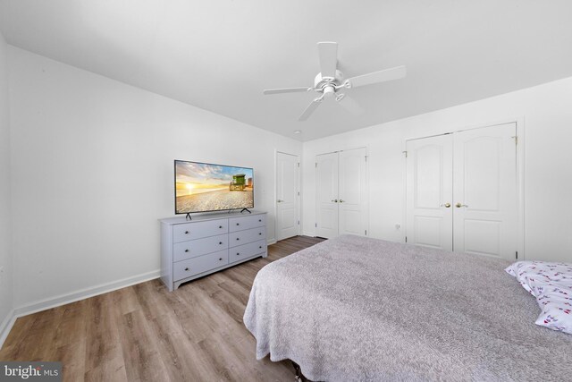 316 Nautilus Dr, Manahawkin, NJ 08050 - bedroom with two closets, wood finished floors, baseboards, and a ceiling fan