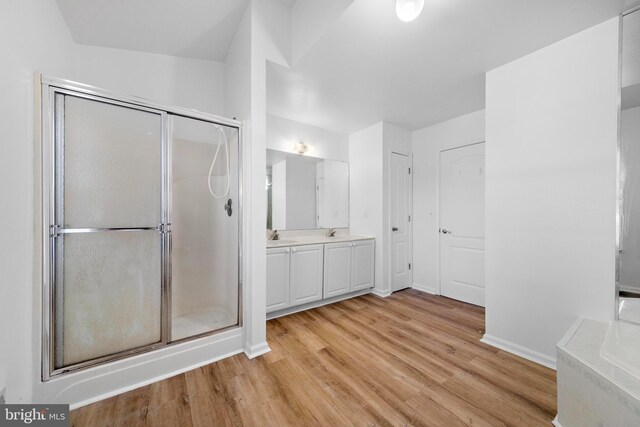 316 Nautilus Dr, Manahawkin, NJ 08050 - bathroom featuring a shower stall, wood finished floors, baseboards, vanity, and a bathtub