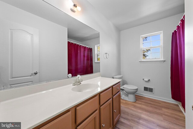 316 Nautilus Dr, Manahawkin, NJ 08050 - bathroom with healthy amount of natural light, vanity, wood finished floors, and toilet