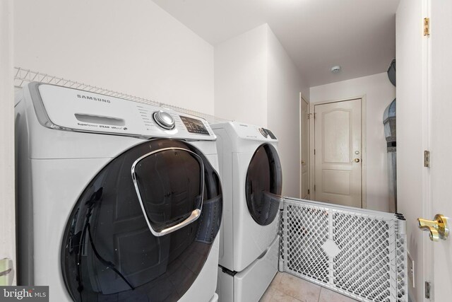 316 Nautilus Dr, Manahawkin, NJ 08050 - clothes washing area with separate washer and dryer and light tile patterned floors