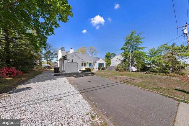 316 Nautilus Dr, Manahawkin, NJ 08050 - view of front of house featuring driveway and a garage