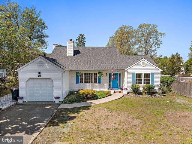 316 Nautilus Dr, Manahawkin, NJ 08050 - view of front of home featuring a porch, an attached garage, driveway, a chimney, and a shingled roof