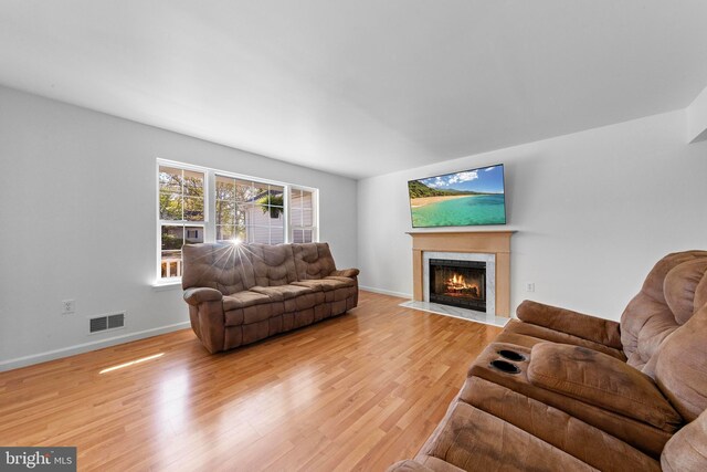 316 Nautilus Dr, Manahawkin, NJ 08050 - living room with a fireplace with flush hearth, light wood finished floors, and baseboards