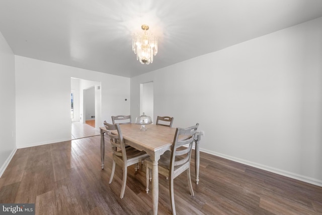 316 Nautilus Dr, Manahawkin, NJ 08050 - dining space with a chandelier, wood finished floors, and baseboards