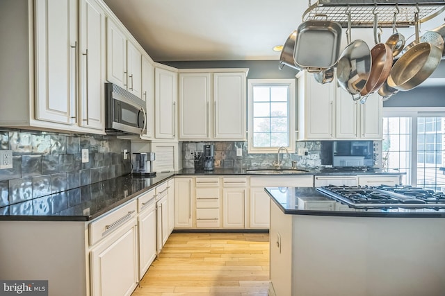 22 Sawgrass Dr, Mount Holly, NJ 08060 - kitchen featuring appliances with stainless steel finishes, a sink, plenty of natural light, and light wood-type flooring