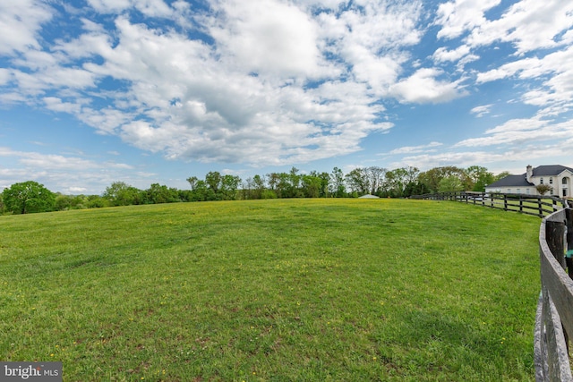 view of yard featuring a view of rural / pastoral area