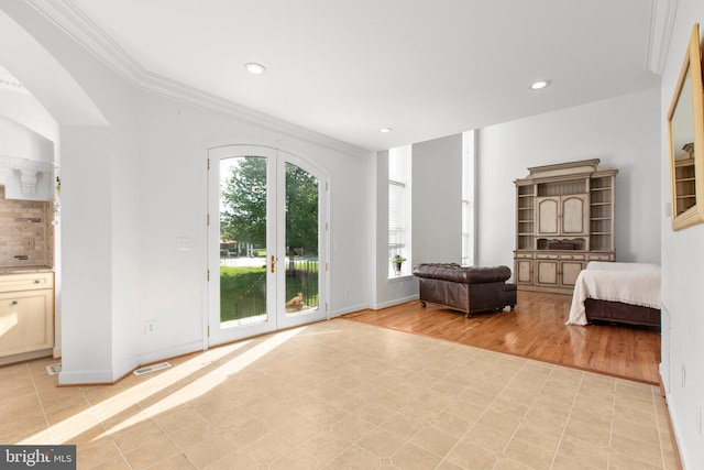 bedroom with access to exterior, multiple windows, crown molding, recessed lighting, and baseboards