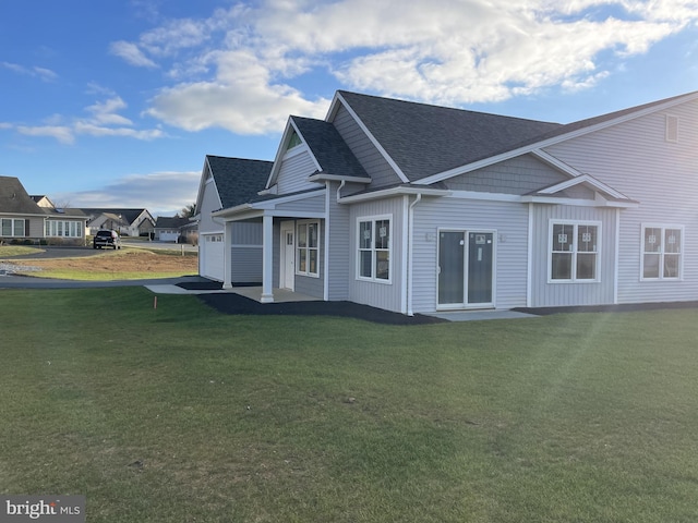 8 Springhaven Ct Unit 242, Palmyra, PA 17078 - rear view of house with an attached garage, a yard, and a shingled roof