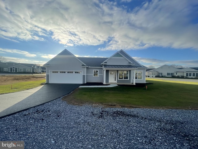 8 Springhaven Ct Unit 242, Palmyra, PA 17078 - ranch-style home with driveway, a front lawn, a garage, metal roof, and a standing seam roof