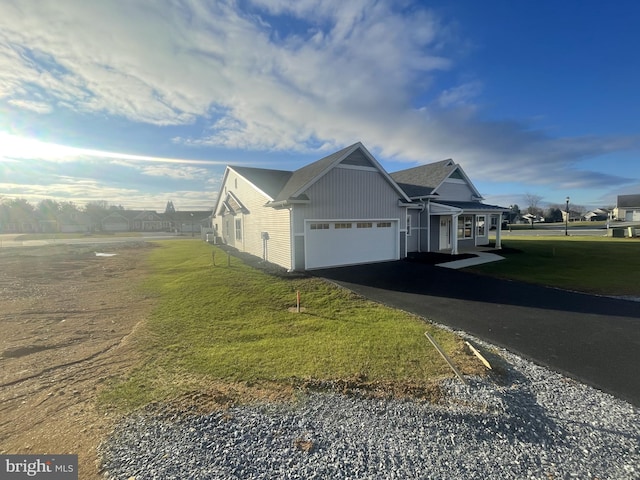 8 Springhaven Ct Unit 242, Palmyra, PA 17078 - view of home's exterior with asphalt driveway, a lawn, and a garage
