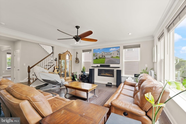 living room with wood finished floors, baseboards, stairway, recessed lighting, and ornamental molding