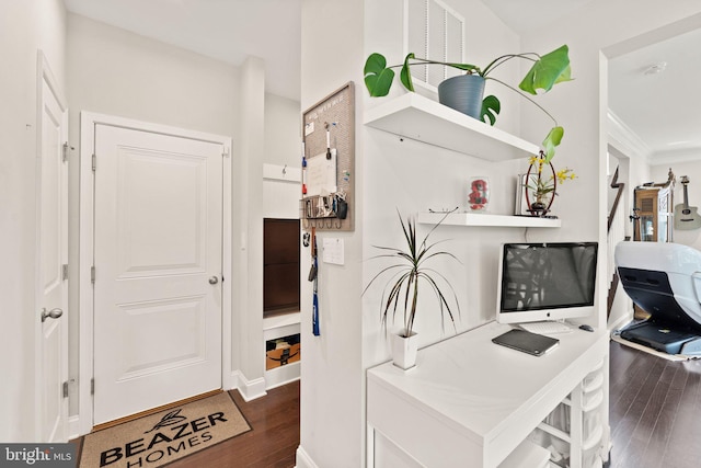 home office with dark wood finished floors and baseboards
