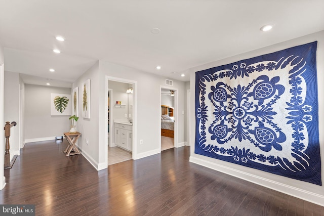 living room with recessed lighting, wood finished floors, and baseboards
