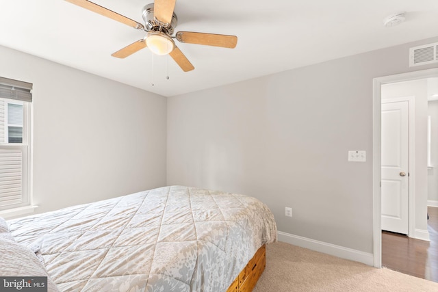 bedroom featuring baseboards, carpet flooring, and ceiling fan
