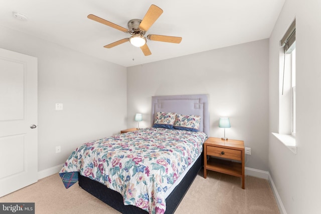 bedroom featuring carpet, baseboards, and a ceiling fan