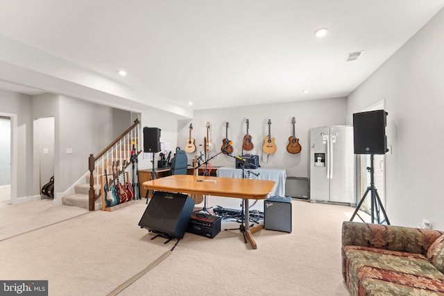 dining space featuring light colored carpet, recessed lighting, and stairs