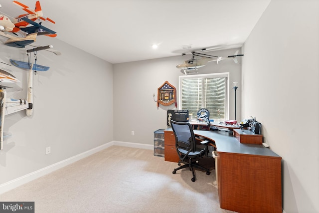 carpeted office featuring baseboards