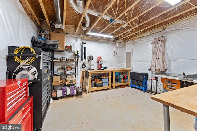 unfinished below grade area featuring a workshop area