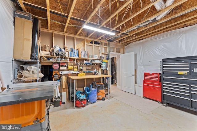 unfinished below grade area with a workshop area