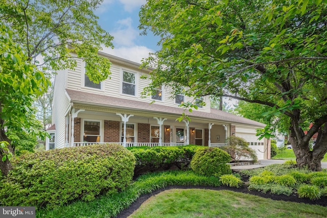 8 Botany Ct, North Potomac, MD 20878 - view of front facade with a porch, a garage, and brick siding