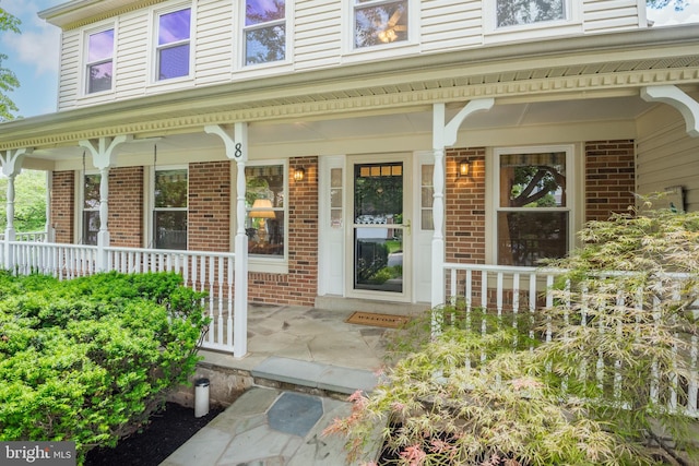 8 Botany Ct, North Potomac, MD 20878 - entrance to property with covered porch and brick siding