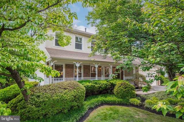 8 Botany Ct, North Potomac, MD 20878 - view of front of house with a porch, brick siding, and a shingled roof