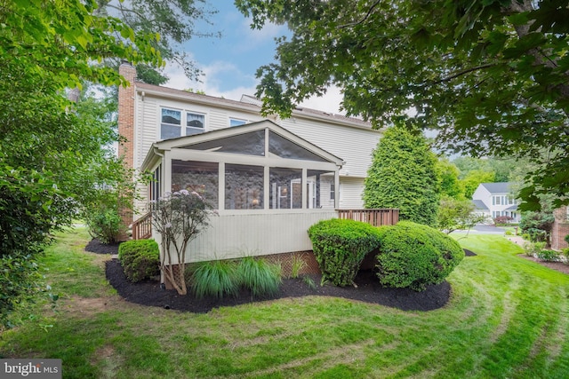 8 Botany Ct, North Potomac, MD 20878 - back of property with a chimney, a sunroom, and a yard