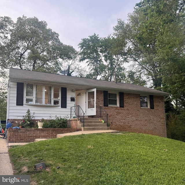 8904 Madison St, Hyattsville, MD 20784 - ranch-style house with a front lawn and brick siding