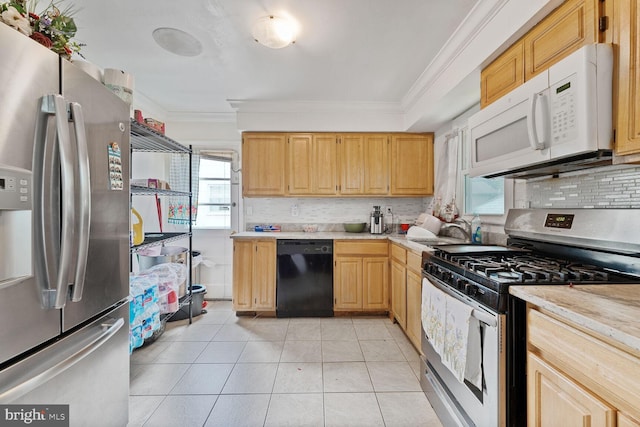 8904 Madison St, New Carrollton, MD 20784 - kitchen featuring appliances with stainless steel finishes, crown molding, light countertops, a sink, and decorative backsplash