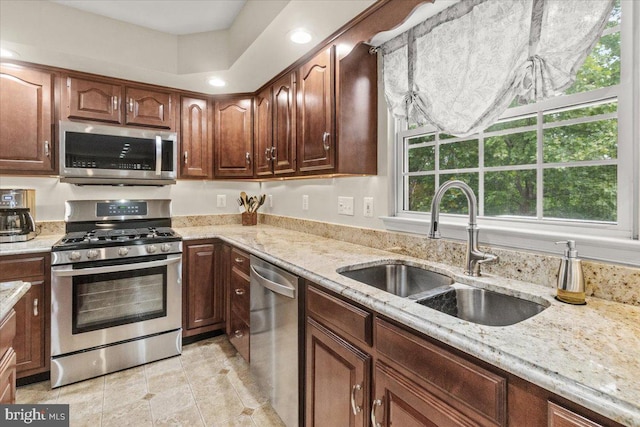 2218 W Greenleaf Dr W, Frederick, MD 21702 - kitchen featuring stainless steel appliances, a sink, light stone countertops, and light tile patterned floors