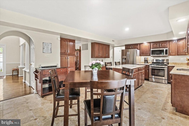 2218 W Greenleaf Dr W, Frederick, MD 21702 - dining area with arched walkways, recessed lighting, and light tile patterned flooring