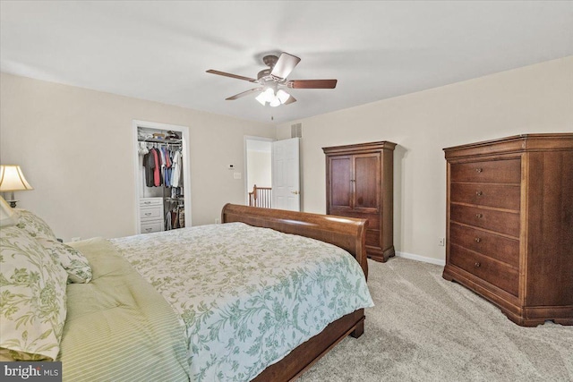 2218 W Greenleaf Dr W, Frederick, MD 21702 - bedroom with light carpet, a spacious closet, a closet, a ceiling fan, and baseboards