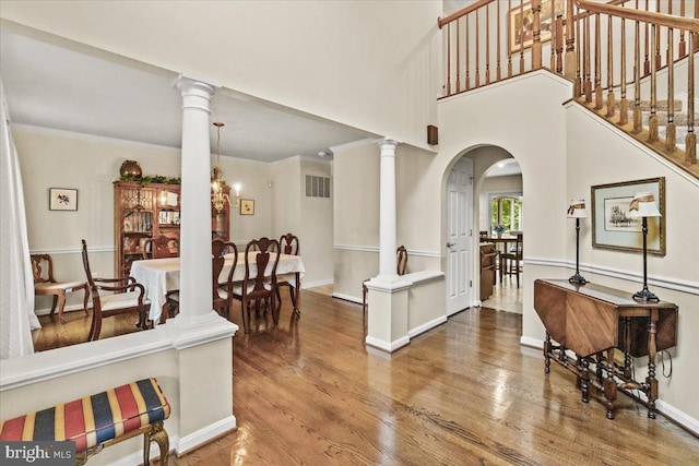 2218 W Greenleaf Dr W, Frederick, MD 21702 - foyer featuring wood finished floors, arched walkways, baseboards, stairway, and crown molding