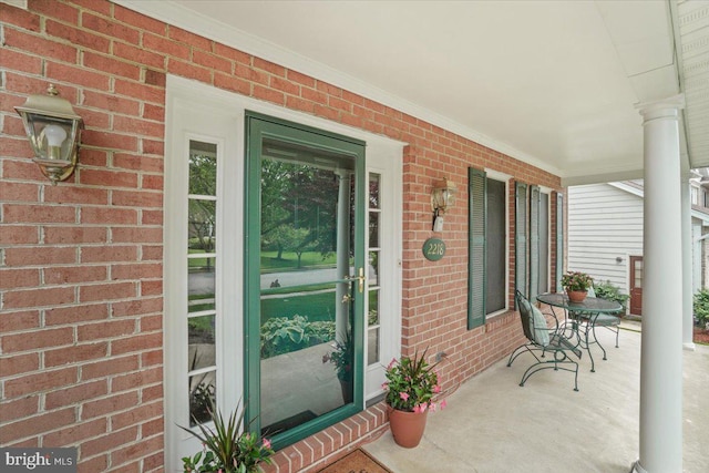 2218 W Greenleaf Dr W, Frederick, MD 21702 - doorway to property with a porch and brick siding